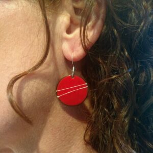 Square Alison with red earrings